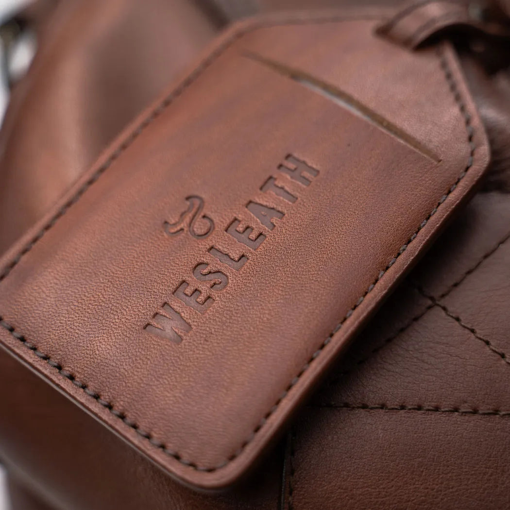 The luggage tag ready in the weekender duffle