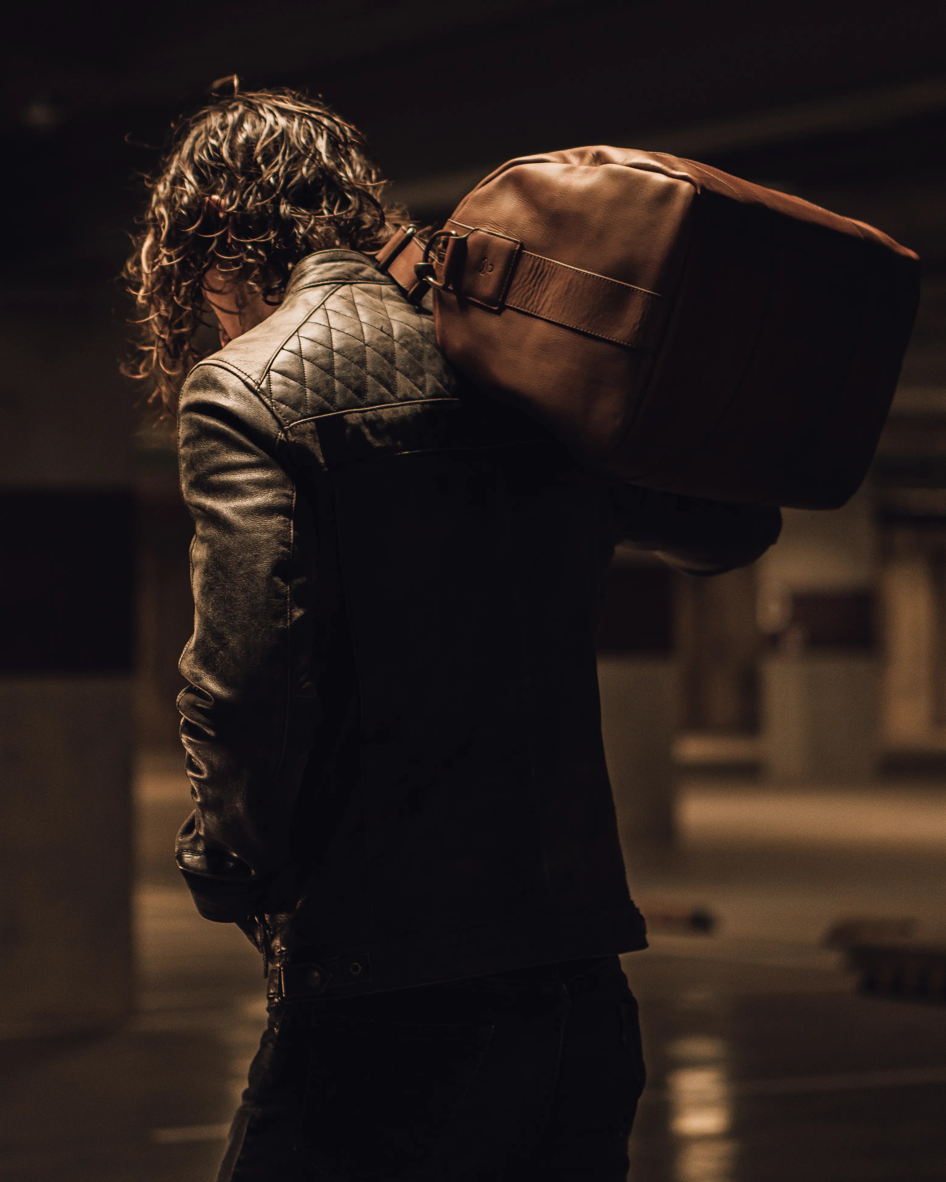 Man turning his back with a wesleath bag